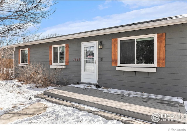 ranch-style house with a deck