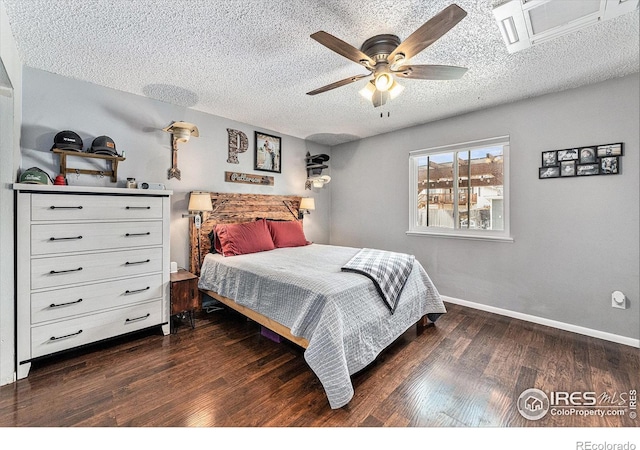 bedroom featuring a textured ceiling, dark hardwood / wood-style flooring, and ceiling fan