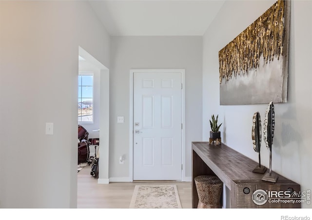 foyer with light wood-type flooring