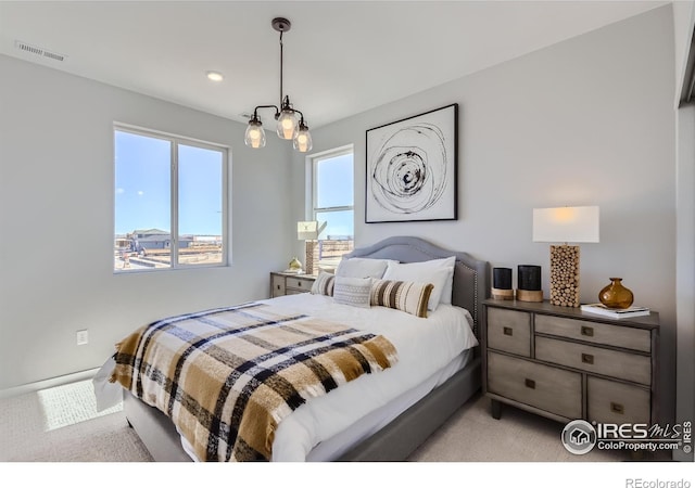 bedroom with light carpet