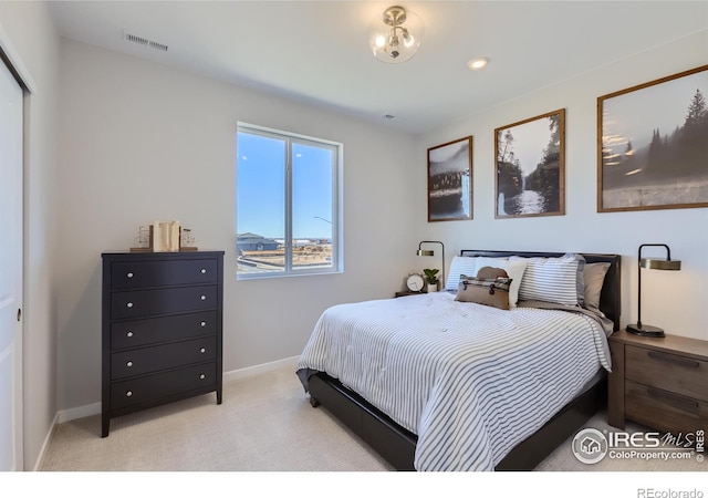 bedroom with light carpet