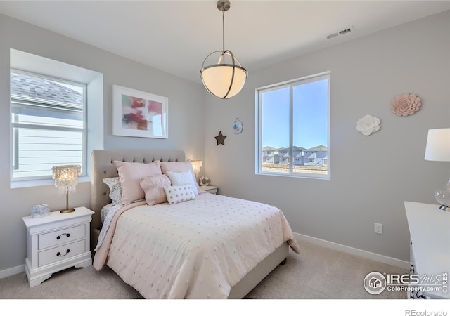 bedroom featuring light colored carpet