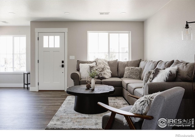 living room featuring dark hardwood / wood-style floors