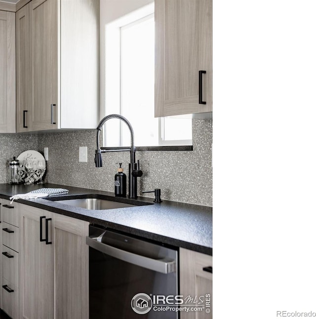 kitchen with dishwasher and light brown cabinetry