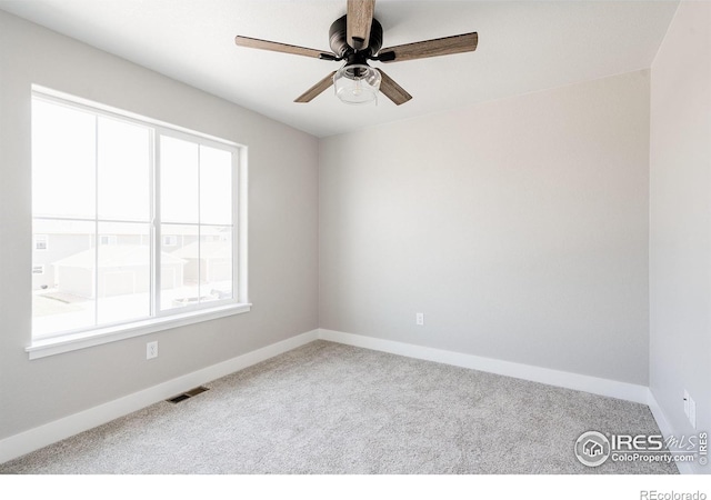 unfurnished room featuring carpet flooring and ceiling fan