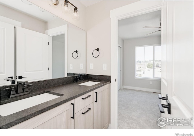 bathroom featuring vanity and ceiling fan