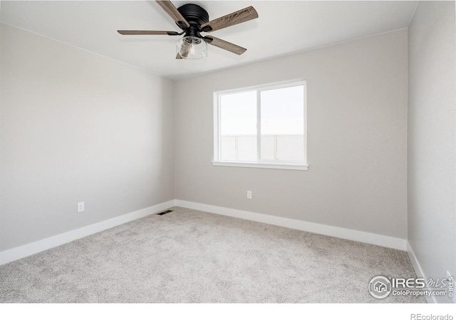 carpeted empty room with ceiling fan