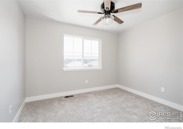 empty room with carpet floors and ceiling fan