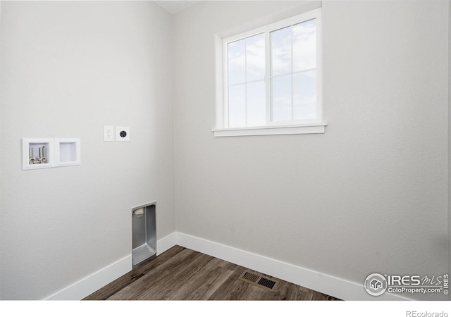 clothes washing area with electric dryer hookup, dark hardwood / wood-style floors, and washer hookup