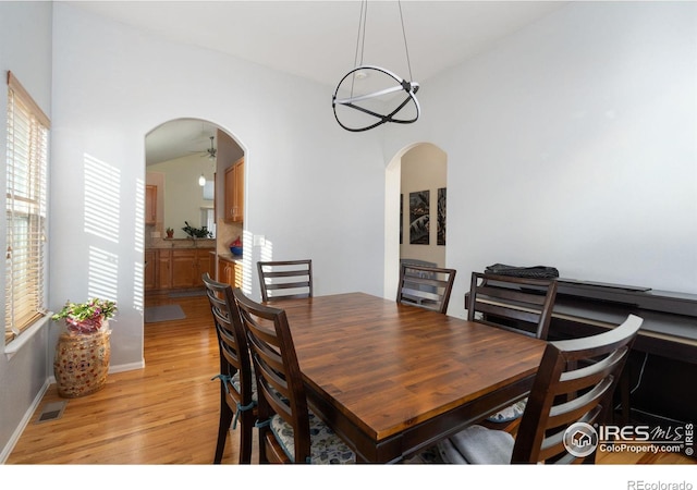 dining room with a chandelier and light hardwood / wood-style floors