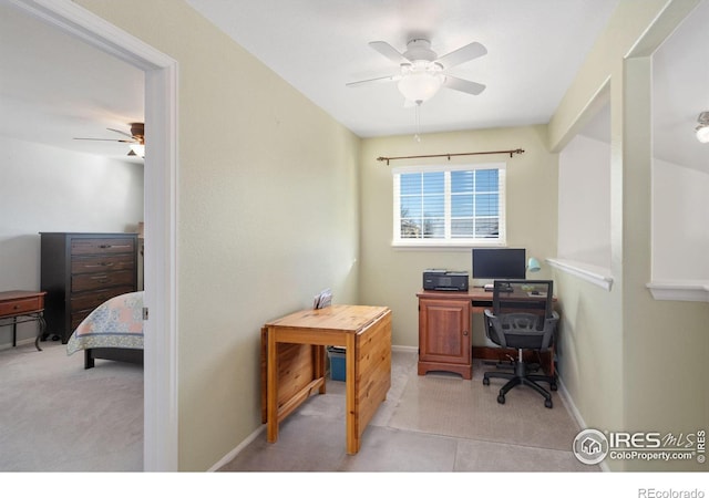 office featuring ceiling fan and light colored carpet