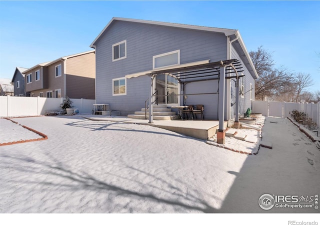 back of house with a pergola and a patio