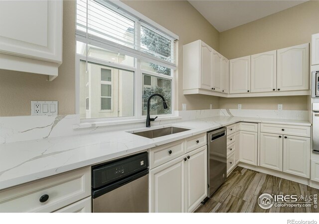 kitchen featuring sink and white cabinets