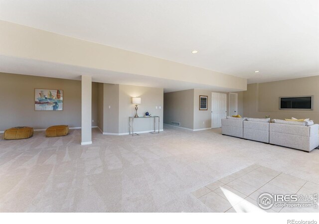 unfurnished living room with light carpet