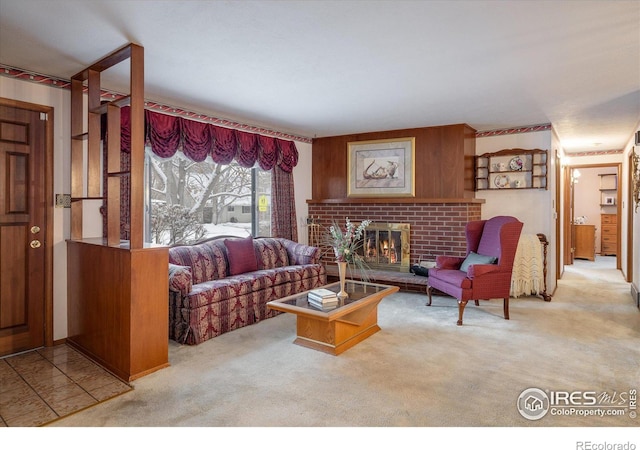 living room featuring light colored carpet and a brick fireplace