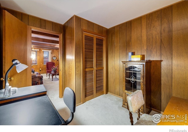 carpeted office with wooden walls