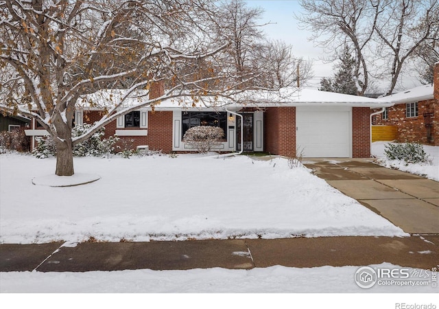 single story home featuring a garage