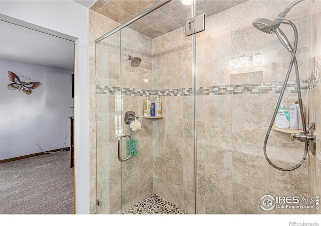 bathroom with a shower with door