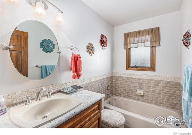 bathroom with vanity and a bathing tub