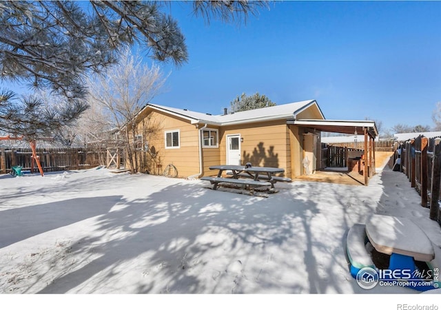 view of snow covered house