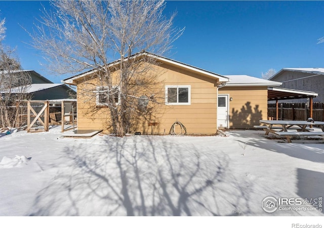 view of snow covered house