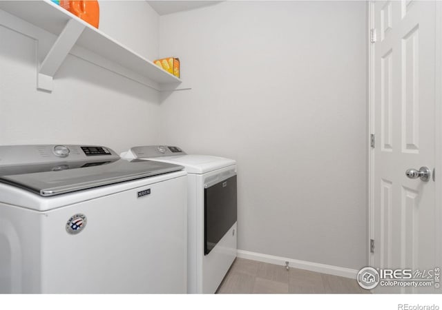 washroom featuring independent washer and dryer