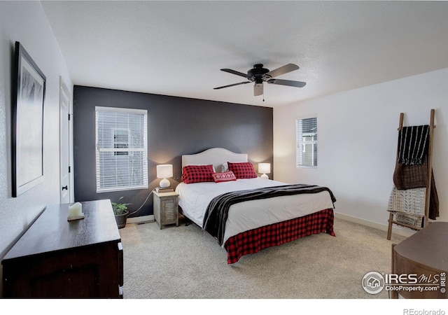 bedroom with ceiling fan and light colored carpet