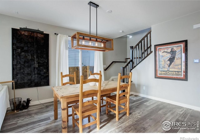 dining space featuring dark wood-type flooring