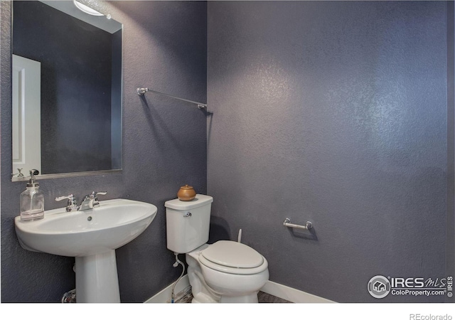 bathroom with sink and toilet