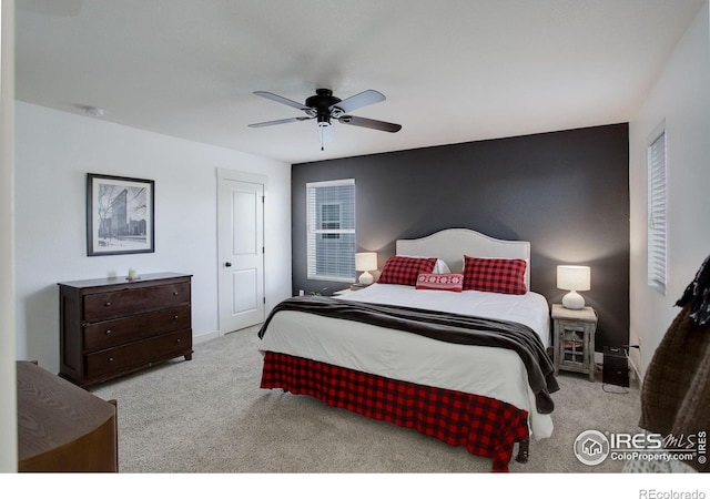 carpeted bedroom with ceiling fan