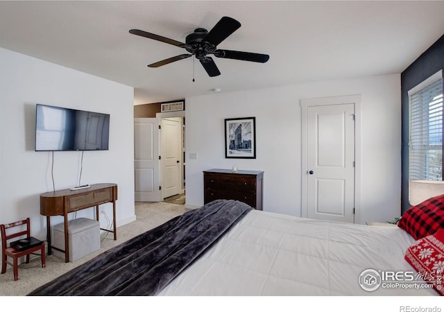 carpeted bedroom with ceiling fan