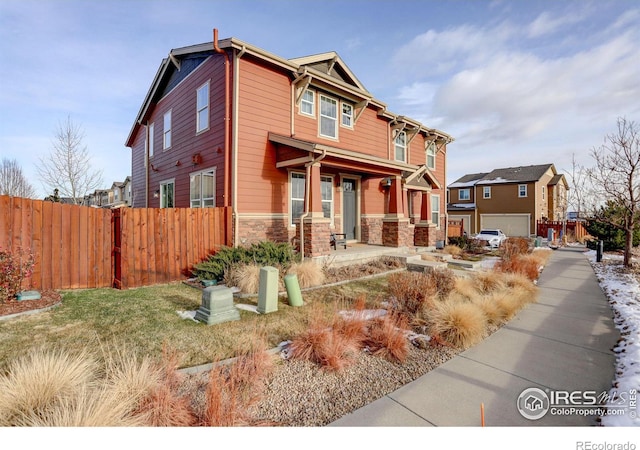 view of front of home featuring a porch and a garage