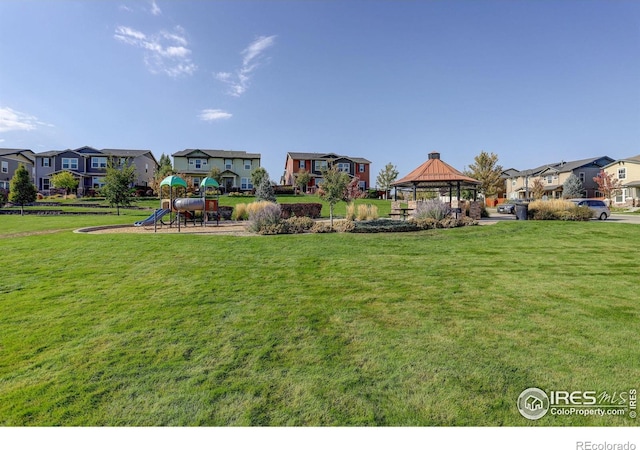 view of yard with a gazebo and a playground