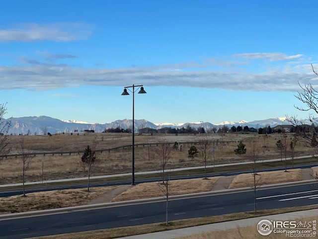 view of mountain feature with a rural view