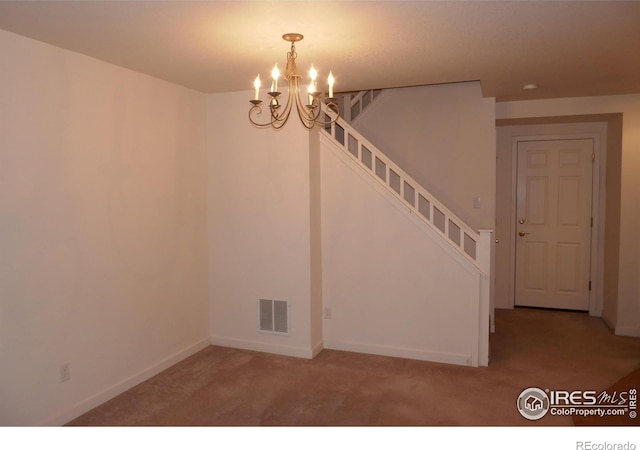 interior space with carpet flooring and a chandelier