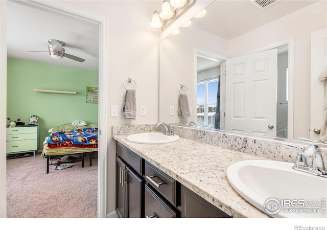 full bathroom with double vanity, ensuite bath, visible vents, and a sink