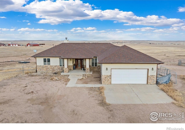 ranch-style home featuring a garage