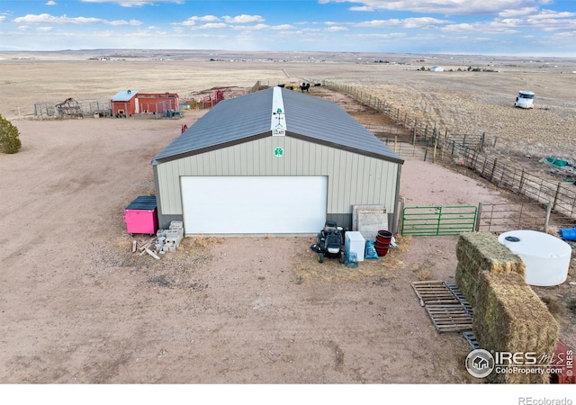 garage featuring a rural view