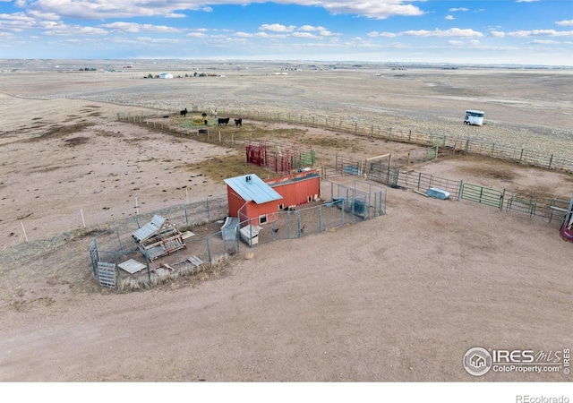 birds eye view of property featuring a rural view