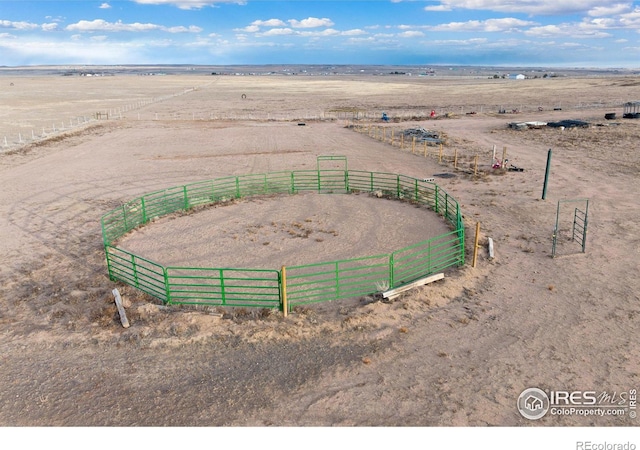 birds eye view of property with a rural view