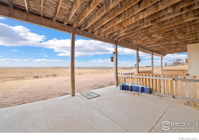 view of patio / terrace with a rural view