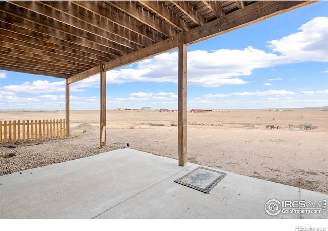 view of patio with a rural view