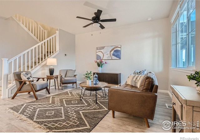 living room with ceiling fan, a healthy amount of sunlight, and hardwood / wood-style flooring