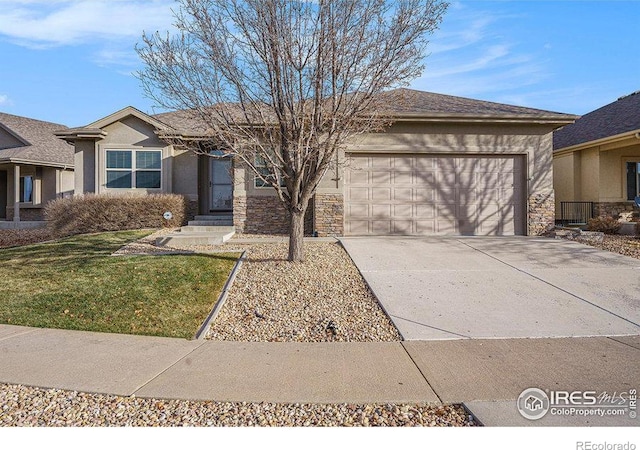 single story home featuring a garage and a front lawn