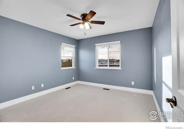 spare room with ceiling fan