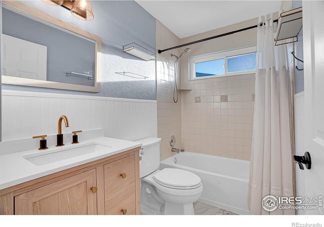 full bathroom featuring shower / bath combination with curtain, toilet, and vanity