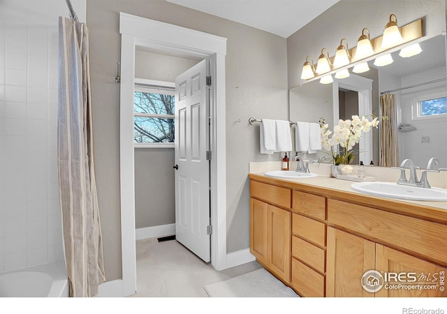 bathroom with vanity and shower / tub combo