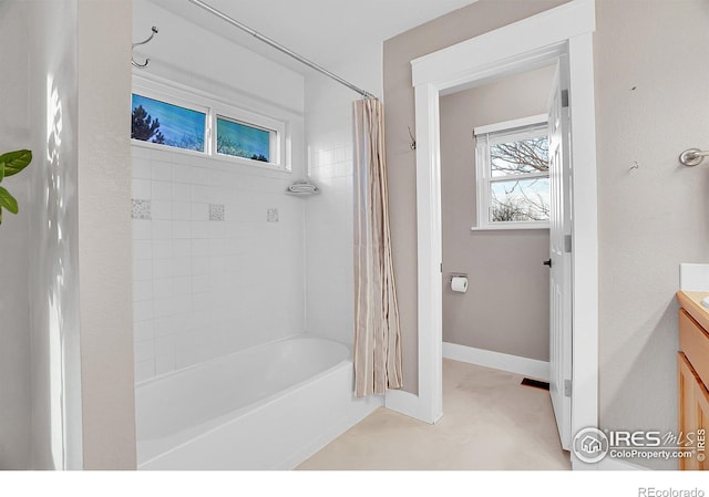 bathroom featuring shower / bath combination with curtain and vanity