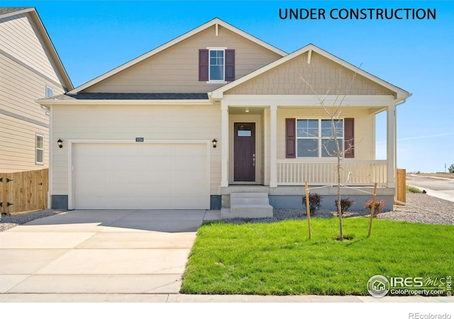 view of front of property with a front lawn and a garage