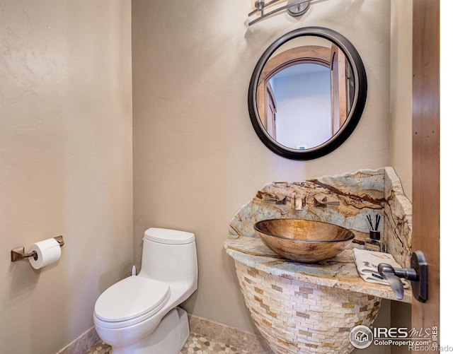 bathroom featuring sink and toilet